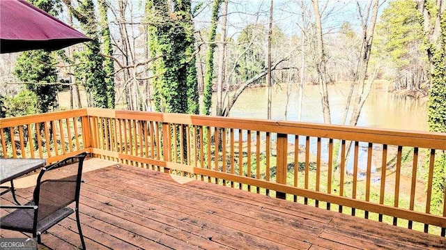 deck featuring a water view