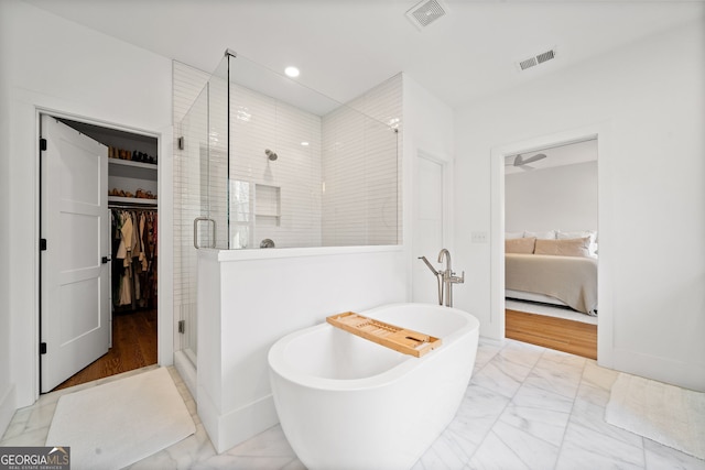 ensuite bathroom with visible vents, marble finish floor, a stall shower, and ensuite bathroom