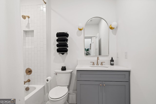 bathroom with vanity, shower / bath combination with curtain, and toilet