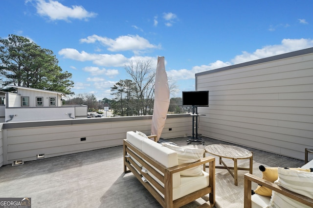 view of patio with a balcony and outdoor lounge area