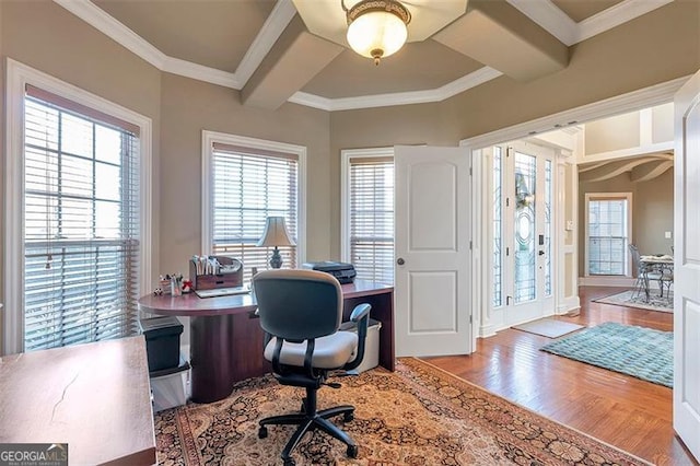 office space featuring beamed ceiling, ornamental molding, and wood finished floors