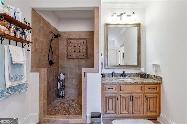 bathroom featuring vanity and a walk in shower