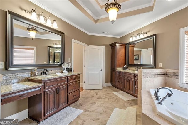 bathroom featuring two vanities, a sink, a tray ceiling, crown molding, and a whirlpool tub