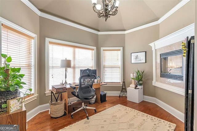 office space featuring plenty of natural light, wood finished floors, and a chandelier