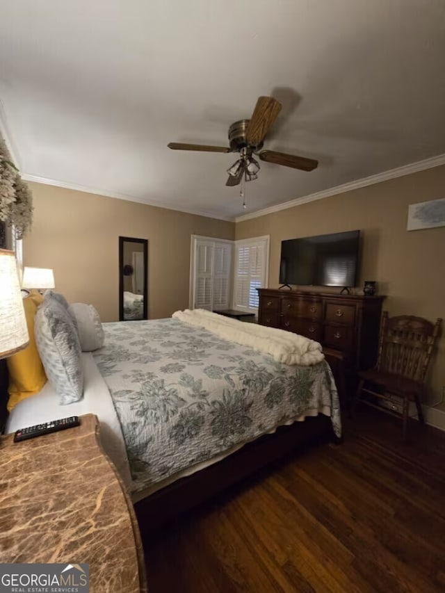 bedroom with a ceiling fan, wood finished floors, and crown molding