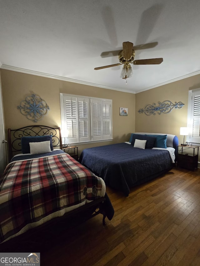 bedroom featuring ceiling fan, crown molding, and hardwood / wood-style flooring