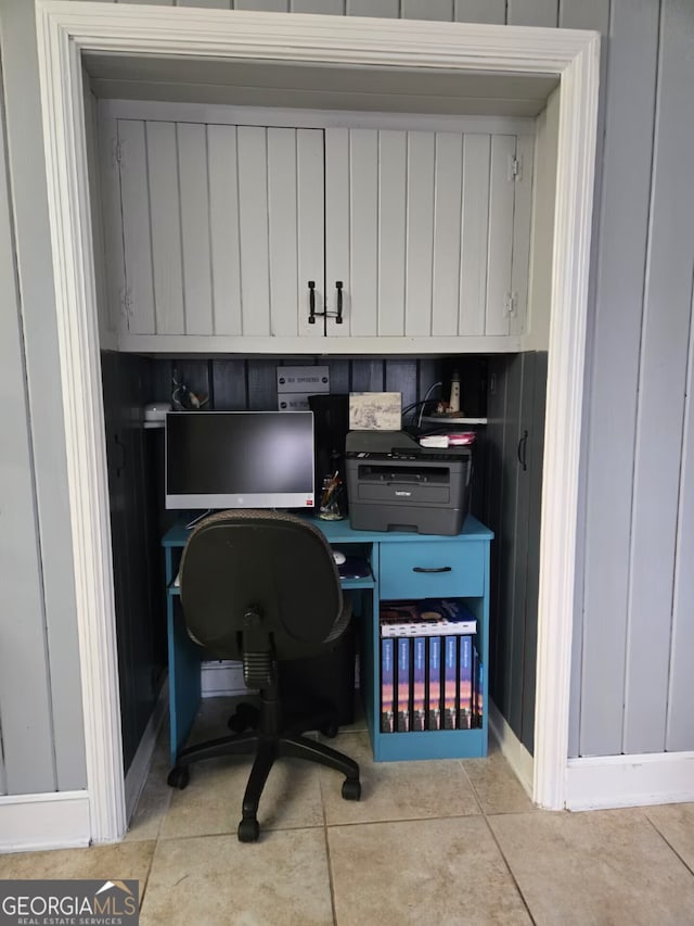 home office with tile patterned flooring