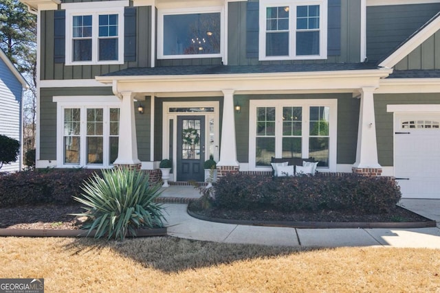 doorway to property featuring a porch and board and batten siding