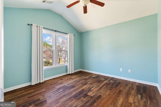 empty room with dark wood-type flooring, baseboards, lofted ceiling, and a ceiling fan