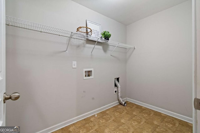 washroom with hookup for a washing machine, baseboards, hookup for an electric dryer, laundry area, and hookup for a gas dryer