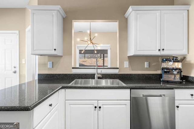 kitchen featuring dishwasher, white cabinets, and a notable chandelier