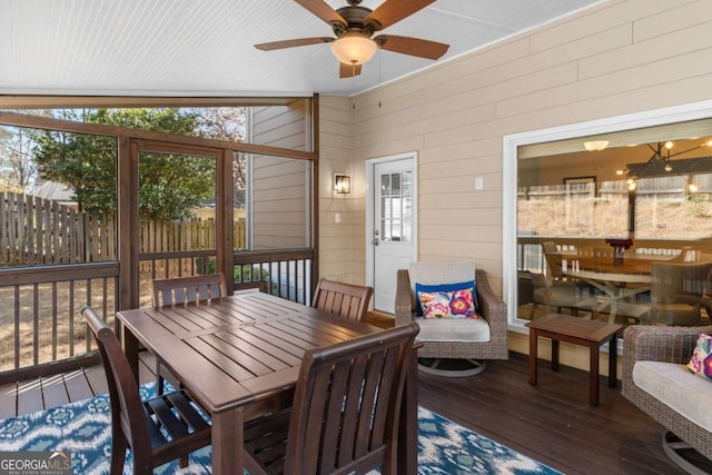 sunroom / solarium with ceiling fan