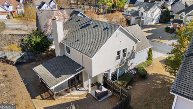 birds eye view of property with a residential view