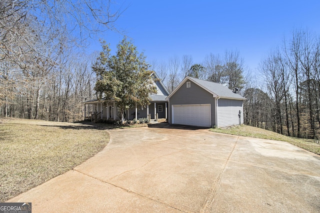 view of front of home featuring driveway and a garage