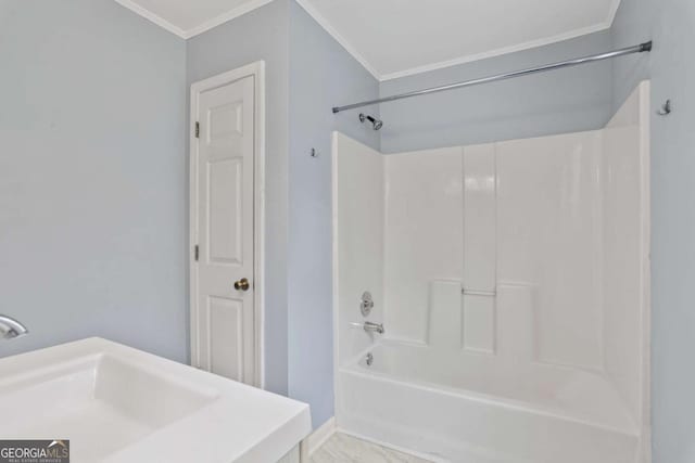 bathroom with  shower combination and ornamental molding