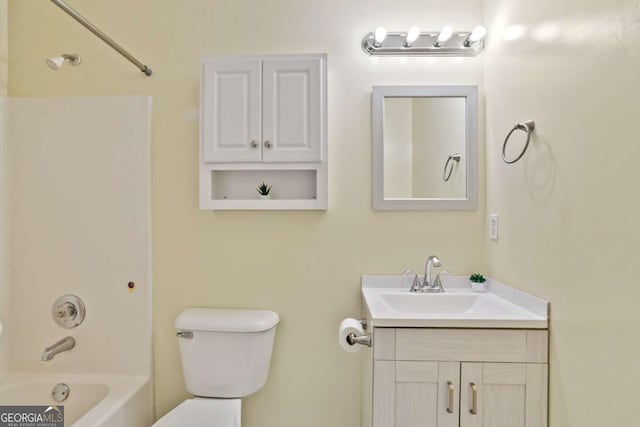 bathroom featuring toilet, shower / washtub combination, and vanity