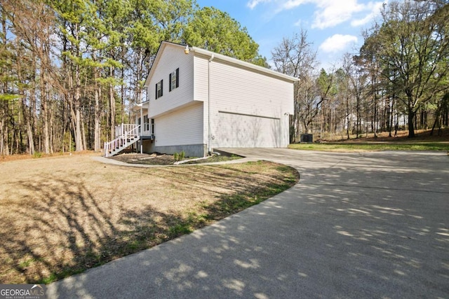 exterior space with an attached garage and concrete driveway