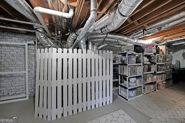 unfinished basement featuring radiator