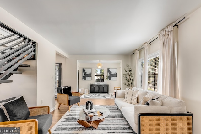 living room with baseboards and wood finished floors