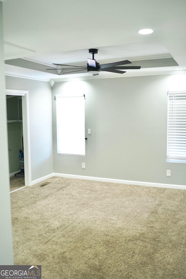 carpeted spare room with recessed lighting, baseboards, ceiling fan, and ornamental molding