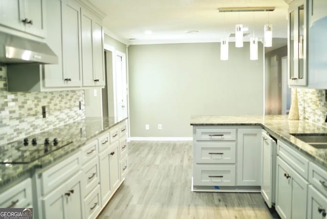 kitchen with light wood-style flooring, a peninsula, black electric cooktop, light stone countertops, and hanging light fixtures