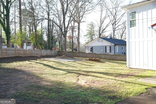 view of yard with a fenced backyard