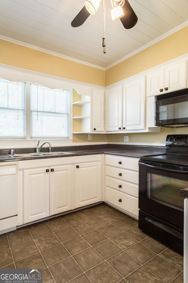 kitchen featuring a healthy amount of sunlight, white cabinetry, black appliances, and ornamental molding