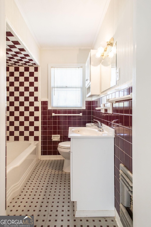 full bath featuring toilet, tile walls, crown molding, a bathtub, and vanity