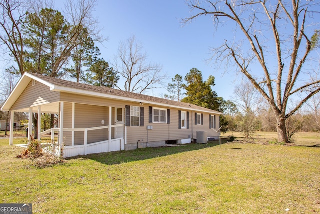 view of front of property with a front lawn and central AC unit