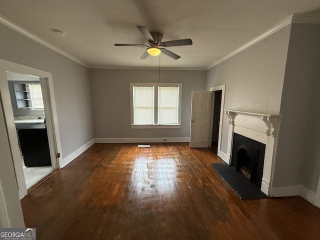 unfurnished living room with wood finished floors, ornamental molding, and a fireplace