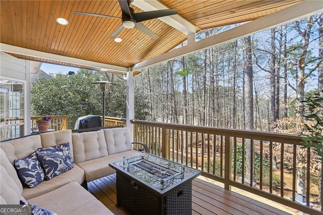 deck with ceiling fan and outdoor lounge area