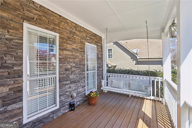 wooden deck featuring a porch