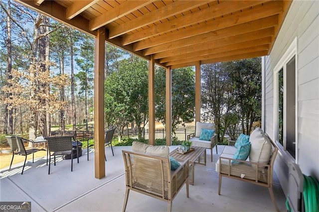 view of patio / terrace featuring outdoor dining area, fence, and an outdoor hangout area