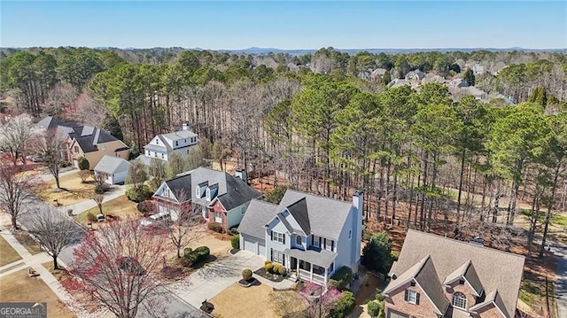 bird's eye view with a residential view and a view of trees