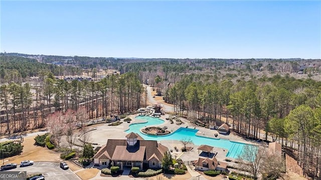 drone / aerial view featuring a forest view