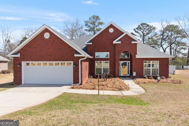 traditional-style house featuring brick siding, driveway, a front lawn, and roof with shingles