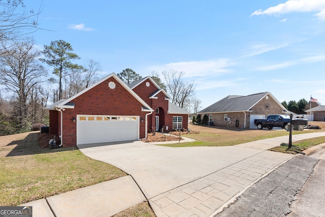 traditional home with brick siding, a garage, driveway, and a front lawn