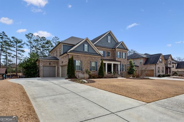 craftsman-style home with brick siding, an attached garage, and driveway