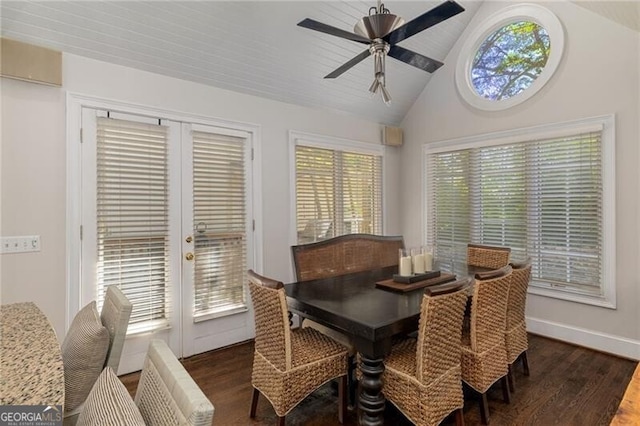 dining space with baseboards, ceiling fan, dark wood finished floors, vaulted ceiling, and french doors