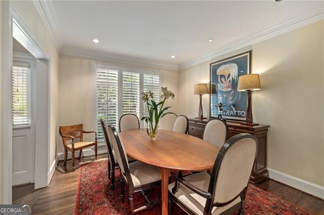 dining area featuring recessed lighting, wood finished floors, baseboards, and ornamental molding