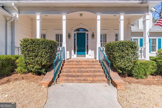 property entrance featuring a porch