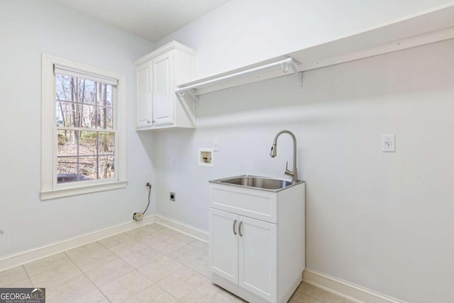 laundry room with electric dryer hookup, washer hookup, a sink, cabinet space, and baseboards