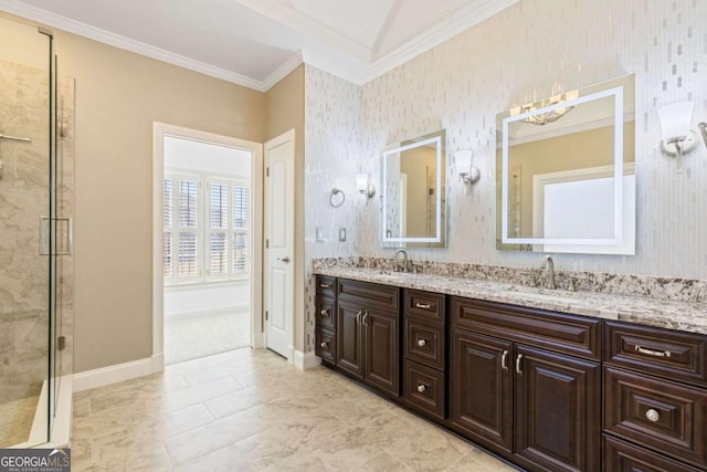 bathroom with ornamental molding, healthy amount of natural light, baseboards, double vanity, and tiled shower