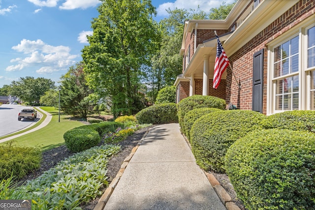 view of side of property featuring brick siding