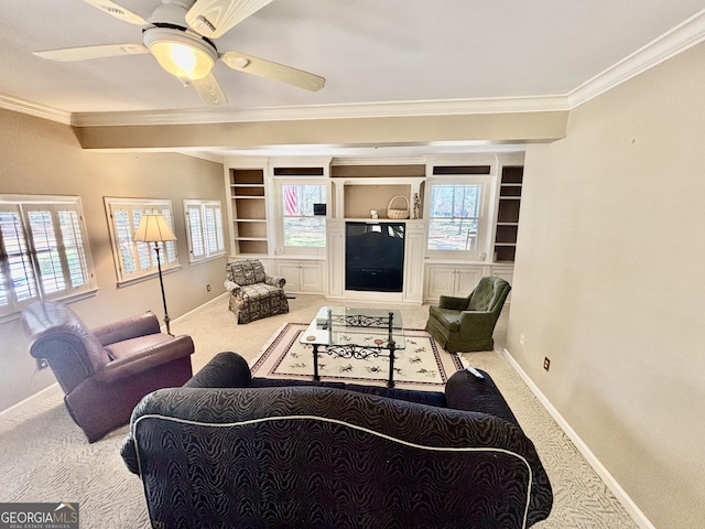 living room with carpet flooring, a wealth of natural light, and ornamental molding