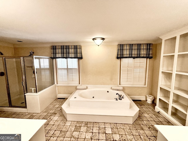full bath with baseboards, a tub with jets, a stall shower, and crown molding