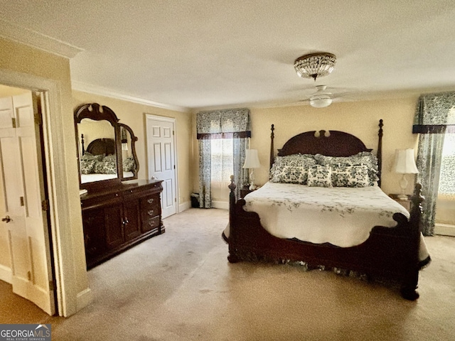 bedroom with carpet floors and ornamental molding