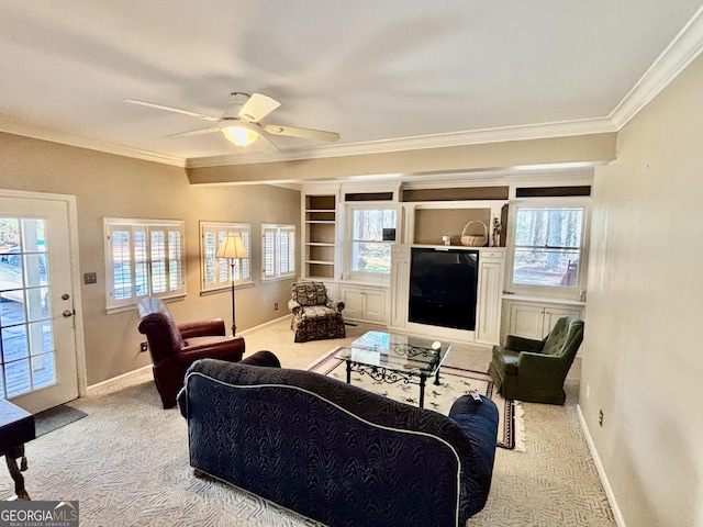 living room with carpet floors, plenty of natural light, and crown molding