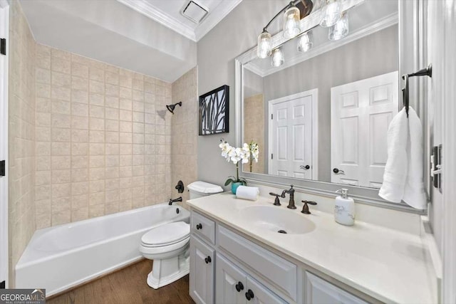 full bath featuring vanity, visible vents, ornamental molding, bathing tub / shower combination, and toilet