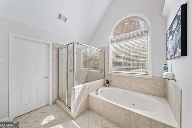 full bath with tile patterned floors, visible vents, a shower stall, and lofted ceiling